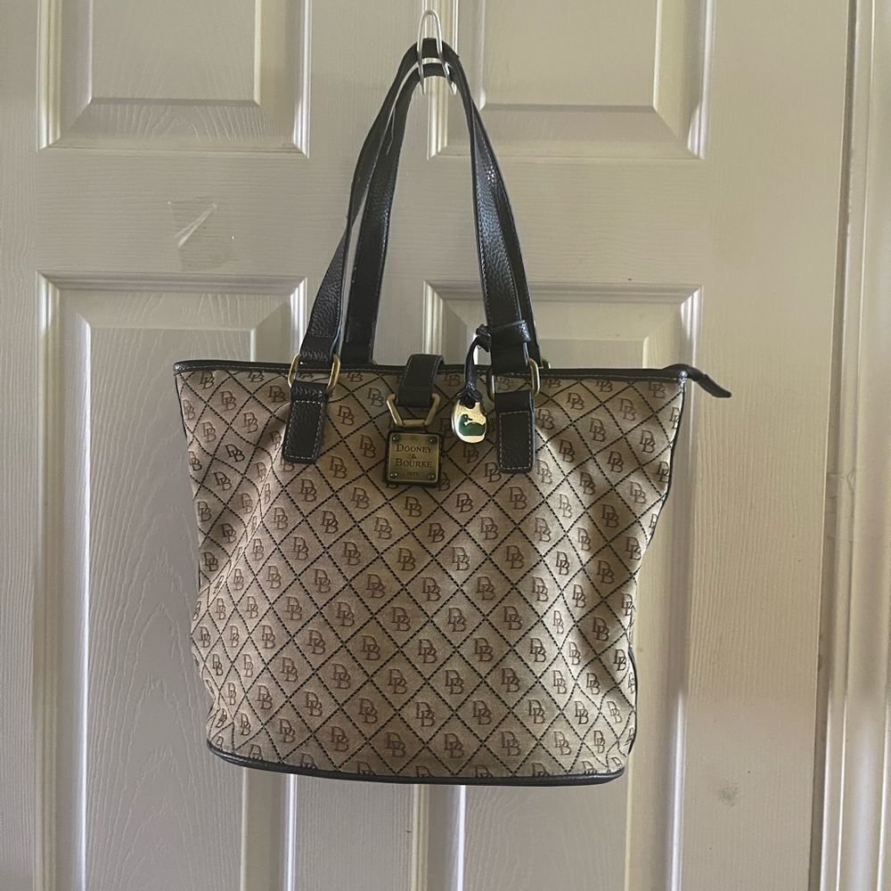 Dooney & Bourke Monogrammed Tan &Brown bucket style tote antique hardwares.